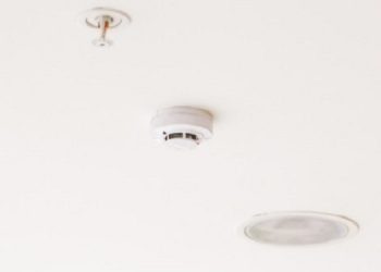Smoke detector mounted on ceiling.