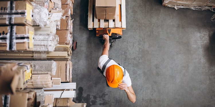 young man working warehouse with boxes 2