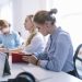 businesswomen sitting row working office